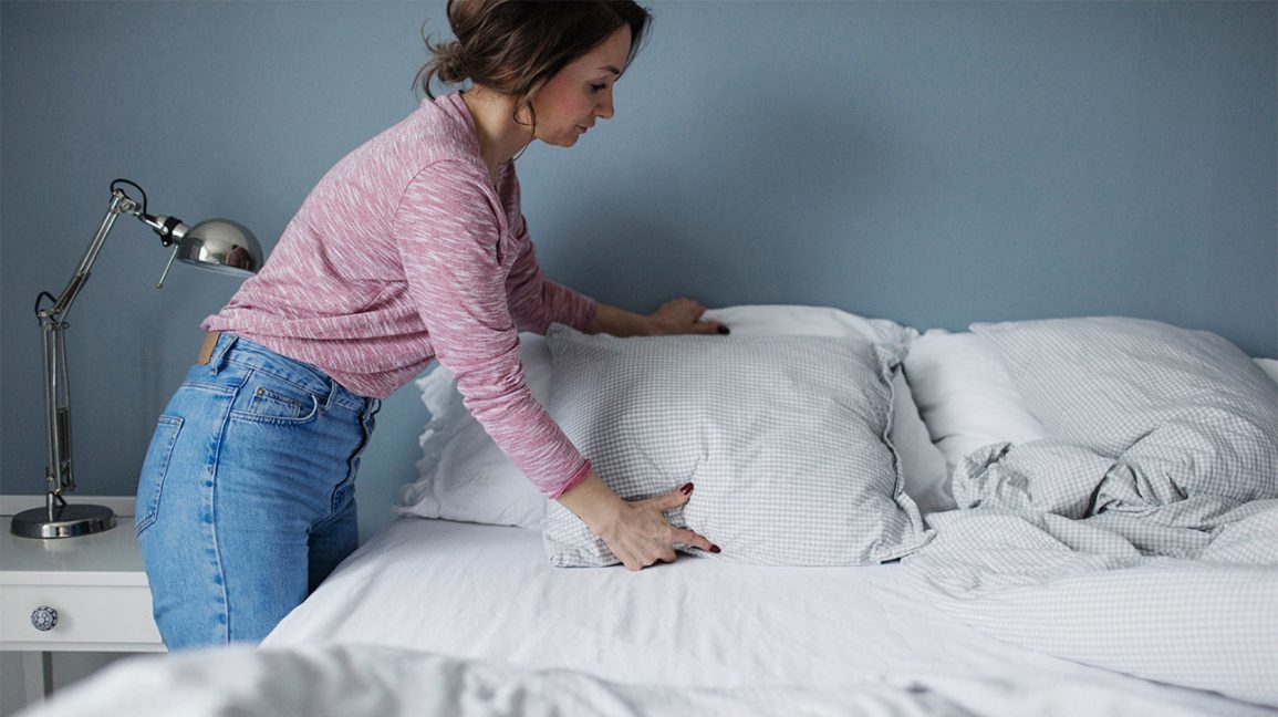 Female Making Bed
